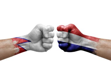 Two hands punch to each others on white background. Country flags painted fists, conflict crisis concept between nepal and netherlands