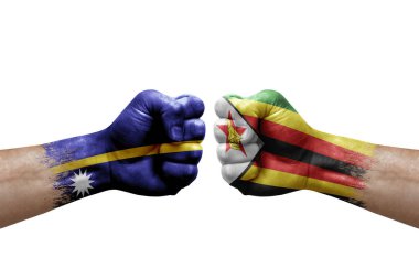 Two hands punch to each others on white background. Country flags painted fists, conflict crisis concept between nauru and zimbabwe