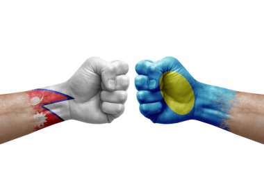 Two hands punch to each others on white background. Country flags painted fists, conflict crisis concept between nepal and palau