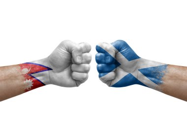 Two hands punch to each others on white background. Country flags painted fists, conflict crisis concept between nepal and scotland