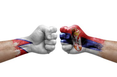 Two hands punch to each others on white background. Country flags painted fists, conflict crisis concept between nepal and serbia