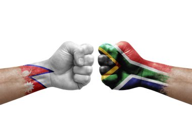 Two hands punch to each others on white background. Country flags painted fists, conflict crisis concept between nepal and south africa