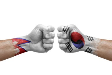 Two hands punch to each others on white background. Country flags painted fists, conflict crisis concept between nepal and south korea
