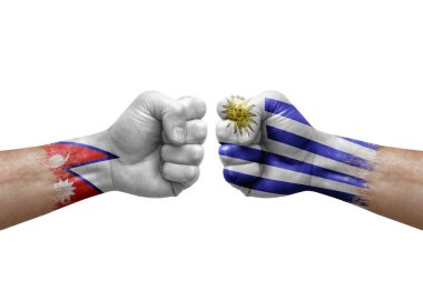 Two hands punch to each others on white background. Country flags painted fists, conflict crisis concept between nepal and uruguay