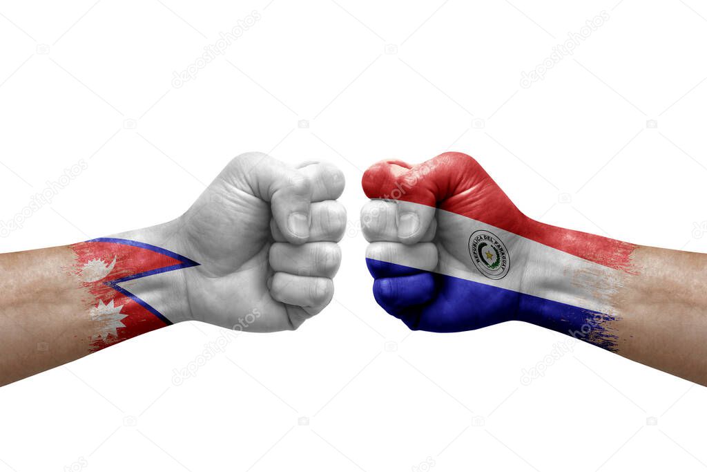 Two hands punch to each others on white background. Country flags painted fists, conflict crisis concept between nepal and paraguay