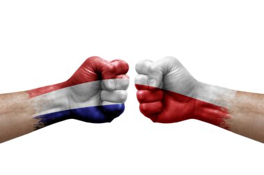 Two hands punch to each others on white background. Country flags painted fists, conflict crisis concept between netherlands and poland