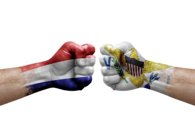 Two hands punch to each others on white background. Country flags painted fists, conflict crisis concept between netherlands and virgin islands