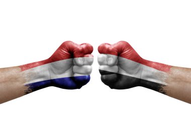 Two hands punch to each others on white background. Country flags painted fists, conflict crisis concept between netherlands and yemen