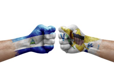 Two hands punch to each others on white background. Country flags painted fists, conflict crisis concept between nicaragua and virgin islands