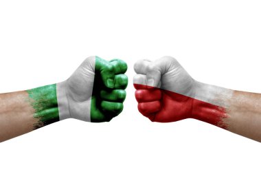 Two hands punch to each others on white background. Country flags painted fists, conflict crisis concept between nigeria and poland
