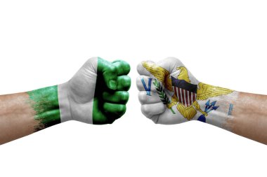Two hands punch to each others on white background. Country flags painted fists, conflict crisis concept between nigeria and virgin islands