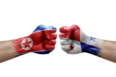 Two hands punch to each others on white background. Country flags painted fists, conflict crisis concept between north korea and panama