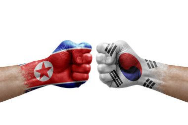 Two hands punch to each others on white background. Country flags painted fists, conflict crisis concept between north korea and south korea