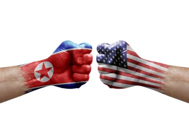 Two hands punch to each others on white background. Country flags painted fists, conflict crisis concept between north korea and usa