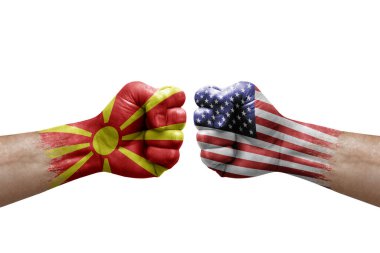 Two hands punch to each others on white background. Country flags painted fists, conflict crisis concept between north macedonia and usa