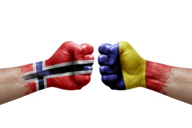 Two hands punch to each others on white background. Country flags painted fists, conflict crisis concept between norway and romania