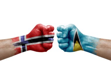 Two hands punch to each others on white background. Country flags painted fists, conflict crisis concept between norway and saint lucia