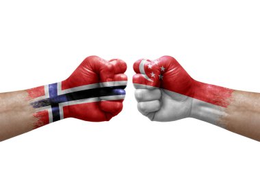 Two hands punch to each others on white background. Country flags painted fists, conflict crisis concept between norway and singapore