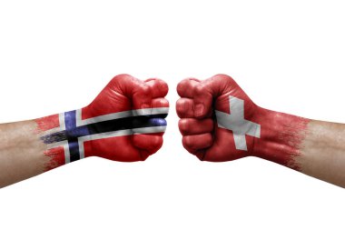 Two hands punch to each others on white background. Country flags painted fists, conflict crisis concept between norway and switzerland