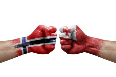 Two hands punch to each others on white background. Country flags painted fists, conflict crisis concept between norway and tonga