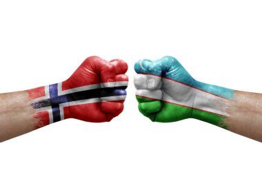 Two hands punch to each others on white background. Country flags painted fists, conflict crisis concept between norway and uzbekistan