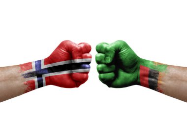 Two hands punch to each others on white background. Country flags painted fists, conflict crisis concept between norway and zambia