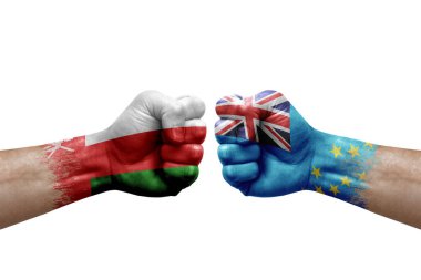 Two hands punch to each others on white background. Country flags painted fists, conflict crisis concept between oman and tuvalu