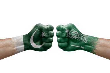 Two hands punch to each others on white background. Country flags painted fists, conflict crisis concept between pakistan and saudi arabia