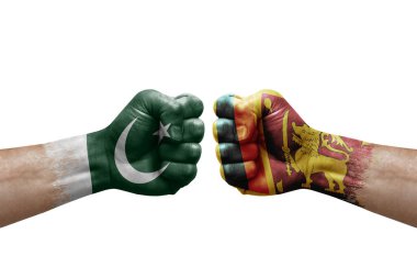 Two hands punch to each others on white background. Country flags painted fists, conflict crisis concept between pakistan and sri lanka
