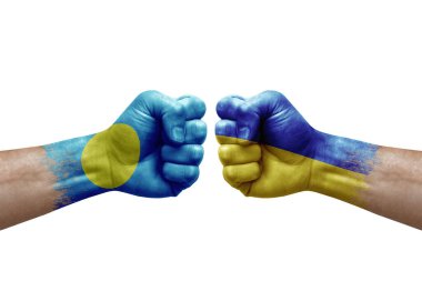 Two hands punch to each others on white background. Country flags painted fists, conflict crisis concept between palau and ukraine