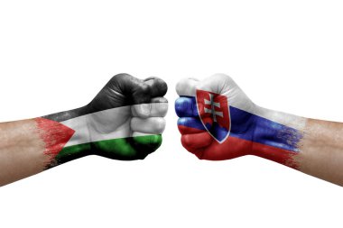 Two hands punch to each others on white background. Country flags painted fists, conflict crisis concept between palestine and slovakia