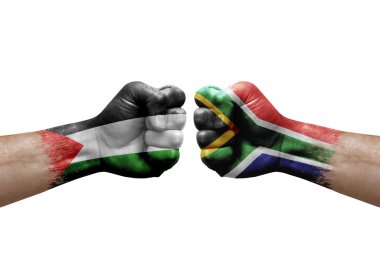 Two hands punch to each others on white background. Country flags painted fists, conflict crisis concept between palestine and south africa