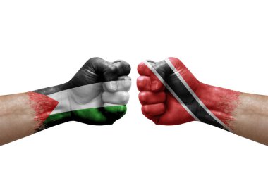 Two hands punch to each others on white background. Country flags painted fists, conflict crisis concept between palestine and tobago