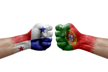 Two hands punch to each others on white background. Country flags painted fists, conflict crisis concept between panama and portugal
