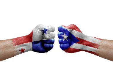 Two hands punch to each others on white background. Country flags painted fists, conflict crisis concept between panama and puerto rico