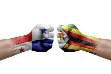 Two hands punch to each others on white background. Country flags painted fists, conflict crisis concept between panama and zimbabwe