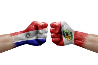 Two hands punch to each others on white background. Country flags painted fists, conflict crisis concept between paraguay and peru