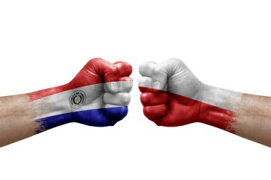 Two hands punch to each others on white background. Country flags painted fists, conflict crisis concept between paraguay and poland
