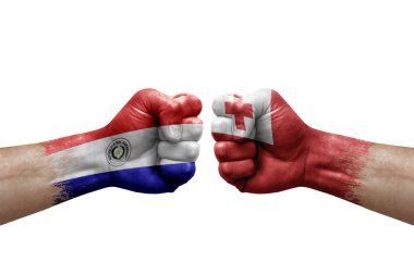 Two hands punch to each others on white background. Country flags painted fists, conflict crisis concept between paraguay and tonga