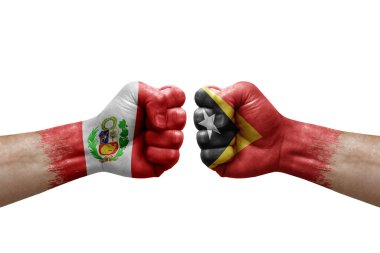 Two hands punch to each others on white background. Country flags painted fists, conflict crisis concept between peru and timor leste