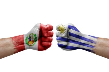 Two hands punch to each others on white background. Country flags painted fists, conflict crisis concept between peru and uruguay