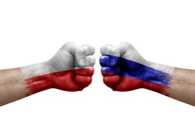 Two hands punch to each others on white background. Country flags painted fists, conflict crisis concept between poland and russia