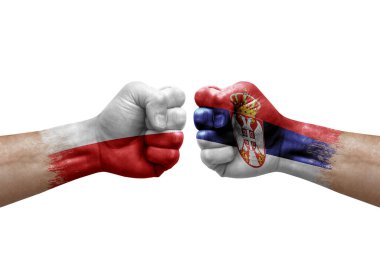 Two hands punch to each others on white background. Country flags painted fists, conflict crisis concept between poland and serbia