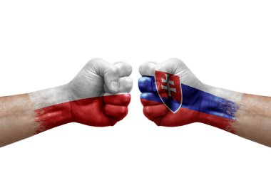 Two hands punch to each others on white background. Country flags painted fists, conflict crisis concept between poland and slovakia