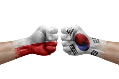 Two hands punch to each others on white background. Country flags painted fists, conflict crisis concept between poland and south korea