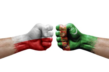 Two hands punch to each others on white background. Country flags painted fists, conflict crisis concept between poland and turkmenistan