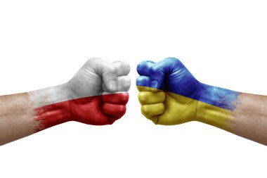 Two hands punch to each others on white background. Country flags painted fists, conflict crisis concept between poland and ukraine
