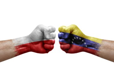 Two hands punch to each others on white background. Country flags painted fists, conflict crisis concept between poland and venezuela