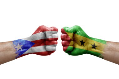 Two hands punch to each others on white background. Country flags painted fists, conflict crisis concept between puerto rico and sao tome and principe