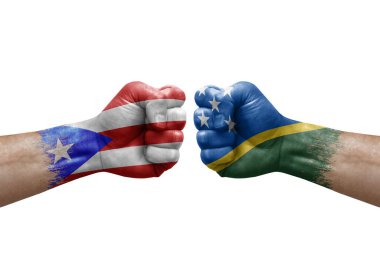 Two hands punch to each others on white background. Country flags painted fists, conflict crisis concept between puerto rico and solomon islands